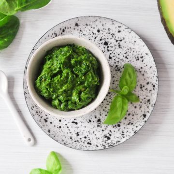 bowl of spinach and avocado vegan pesto