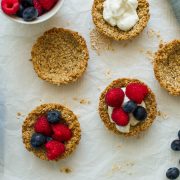 homemade granola cups filled with yogurt and berries