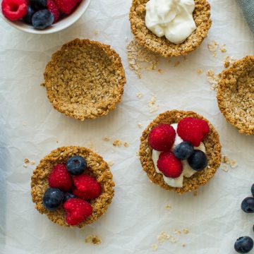 homemade granola cups filled with yogurt and berries