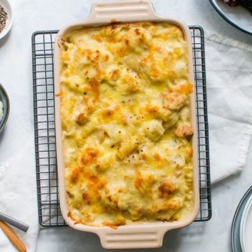 creamy tuna and cauliflower pasta bake in baking dish baked and golden