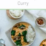 creamy vegan chickpea curry with spinach an mushrooms in bowl served with rice