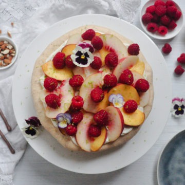 peach melba almond meringue gateau with fresh raspberries and peaches