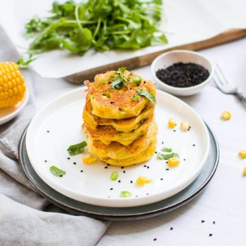 Sweetcorn fritters on plate with sesame seeds as a healthy toddler snack