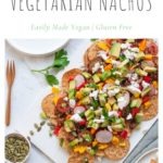 healthy nachos with beans and vegetables on white serving plate