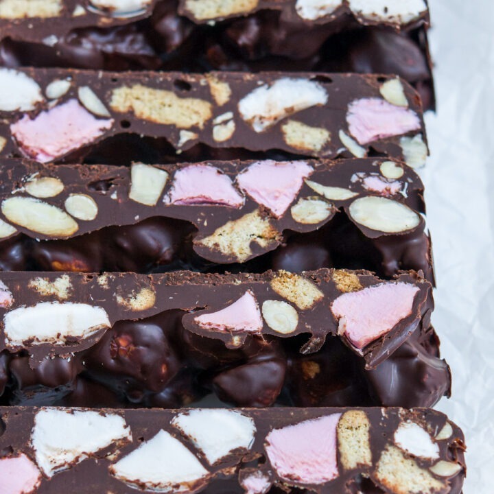 close up of slices of easy peasy rocky road to show the ingredients used: dark chocolate, biscuit, marshmallows and almonds