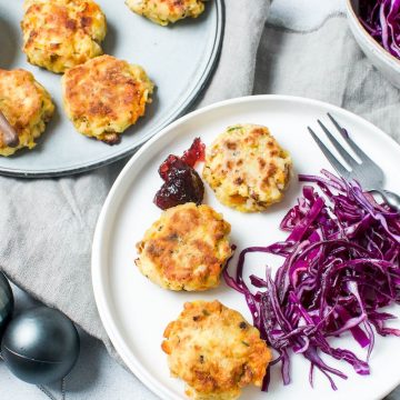 leftover Christmas turkey patties on white plate served with red cabbage and cranberry sauce
