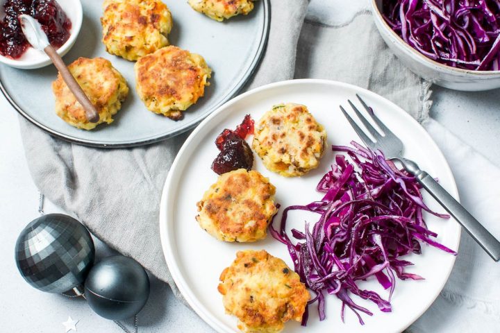 leftover Christmas turkey patties on white plate served with red cabbage and cranberry sauce