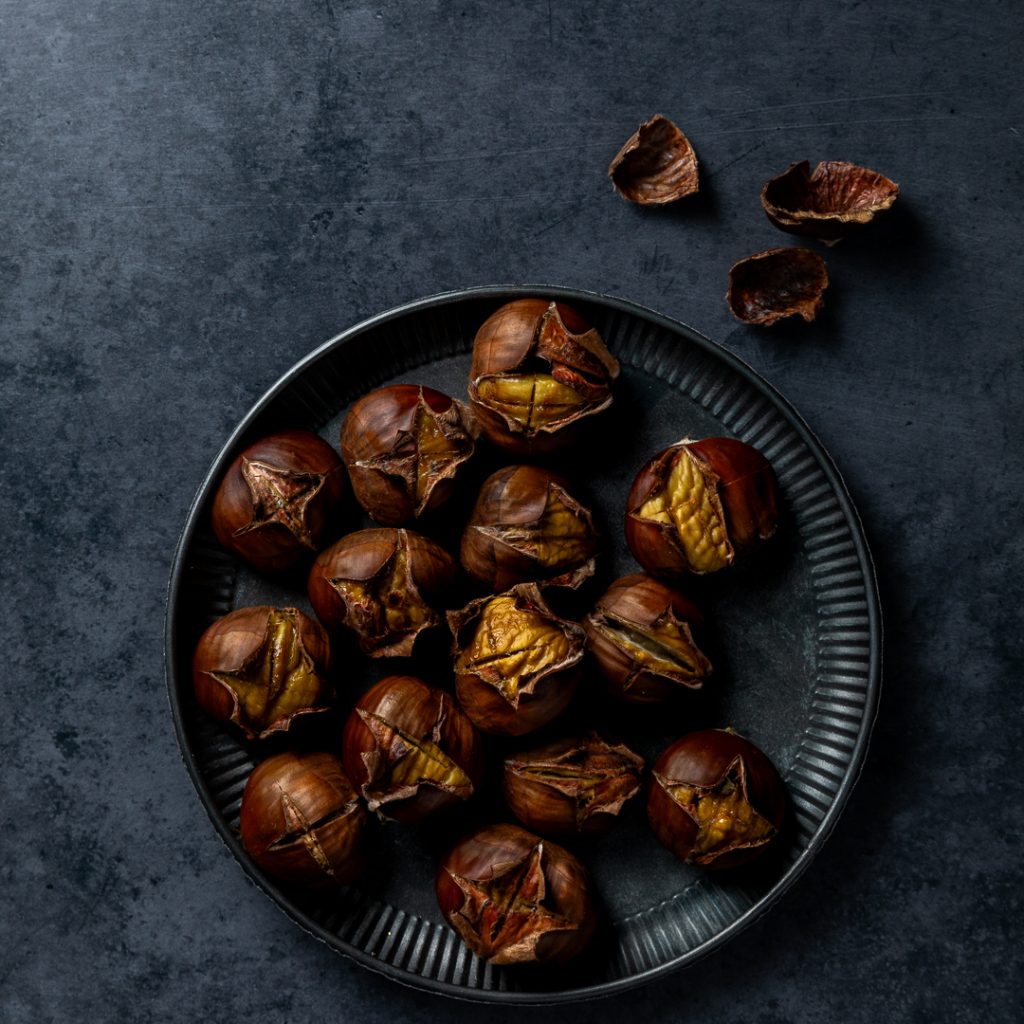Roasted Chestnuts on a metal dish.
