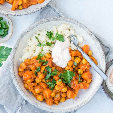 overhead photo of one bowl of chickpea tagine with fork ready to be eaten