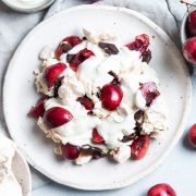 black forest eton mess surrounded by a bowl of cherries and a bowl of chocolate