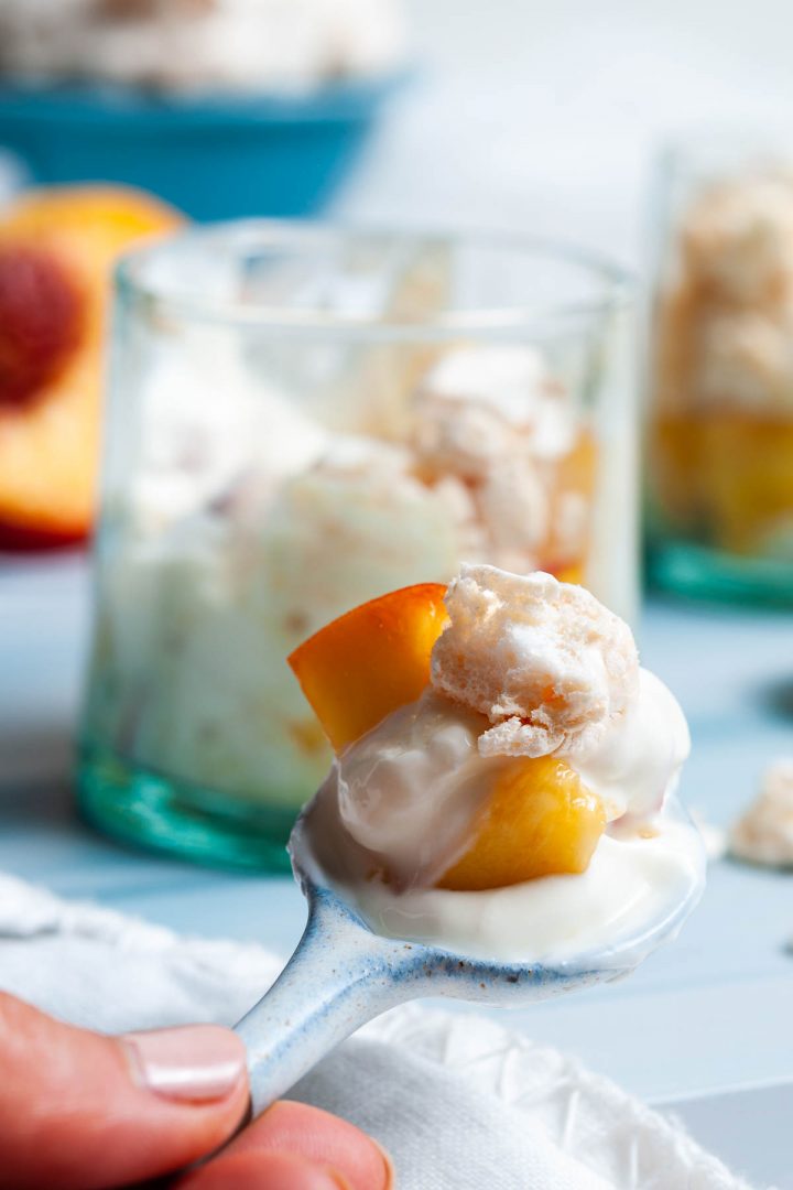 a photo showing close up of spoonful of the dessert to show the chunks of juicy peaches