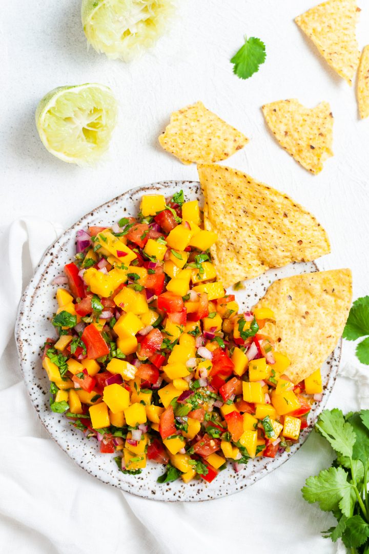 mango salsa on plate with tortilla chips, ready to eat and enjoy