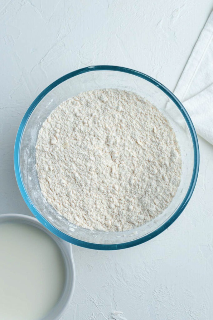 The butter rubbed in to the flour in a bowl.