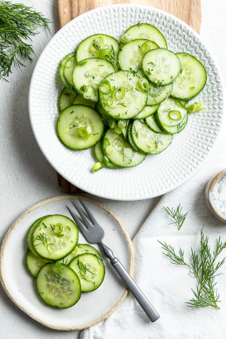 gurkensalat on serving dish and smaller dish with a fork ready to eat
