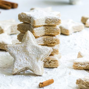 German Chistmas biscuits in a stack, one star on its edges to show the meringue top