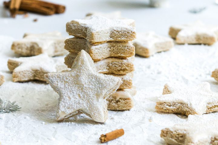 German Chistmas biscuits in a stack, one star on its edges to show the meringue top