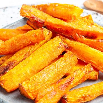 cooked air fryer carrot sticks on a plate