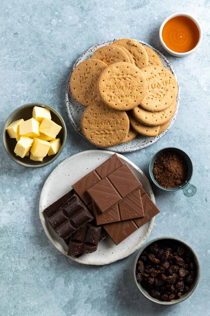 Ingredients measured and weighed out in individual bowls, chocolate and digestive biscuits on plates