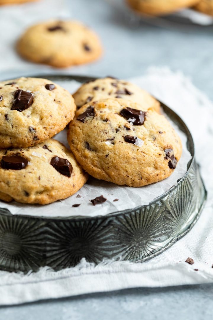 baked chocolate chip cookies made with white sugar on a metal plate ready to be served