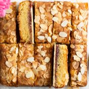 overhead photo of cut almond slice, two bars on their side to show the jam layer and pastry base