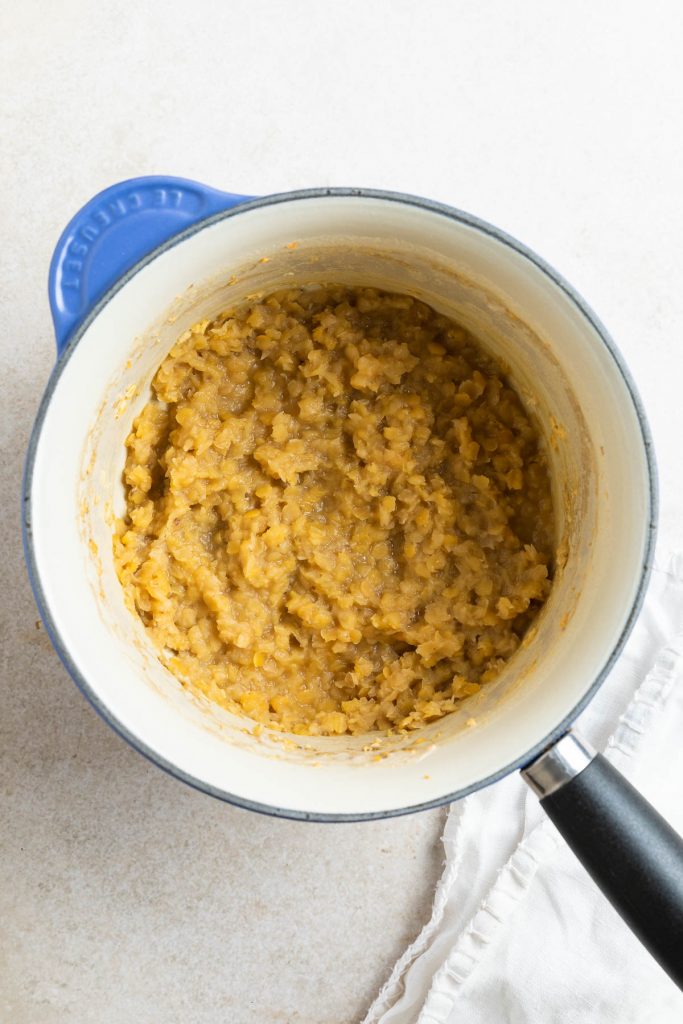 cooked red lentils in a pan to show soft texture