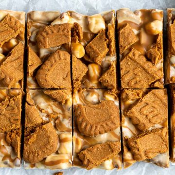 overhead photo of the top of cut Biscoff rocky road to show the Lotus biscoff biscuit decoration and cookie butter swirls