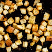 cooked and golden bread crust croutons in a pan