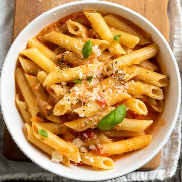 white bowl filled with tomato penne pasta