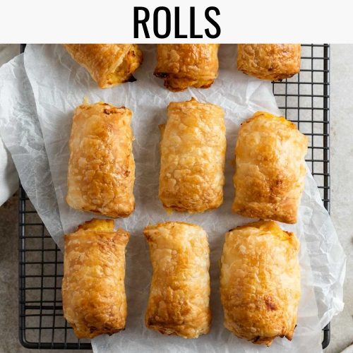 a cooling rack with baked cheese rolls on it with a text overlay creating a pin for Pinterest for cheese and onion rolls