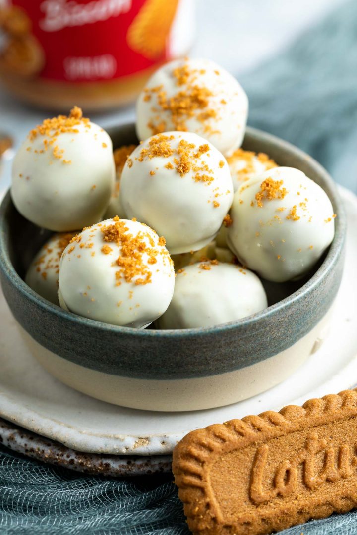 a blue bowl filled with white chocolate Lotus balls