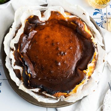 whole baked San Sebastian cheesecake in baking paper