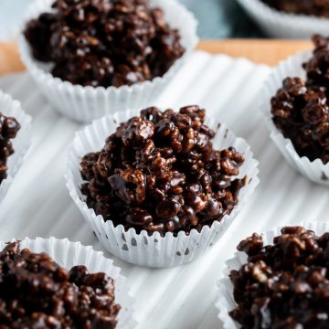 chocolate rice krispies cakes on a white serving platter