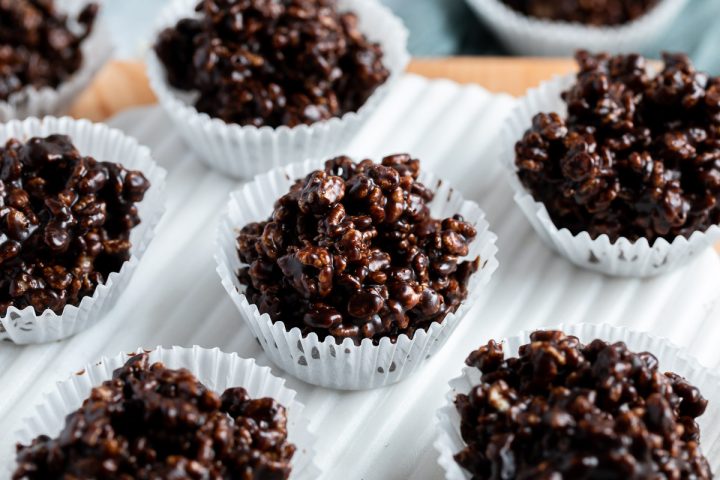 chocolate rice krispies cakes on a white serving platter