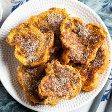 plate of Spanish torrijas with extra cinnamon sugar to serve