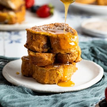 stack of Spanish torrijas drizzled with honey