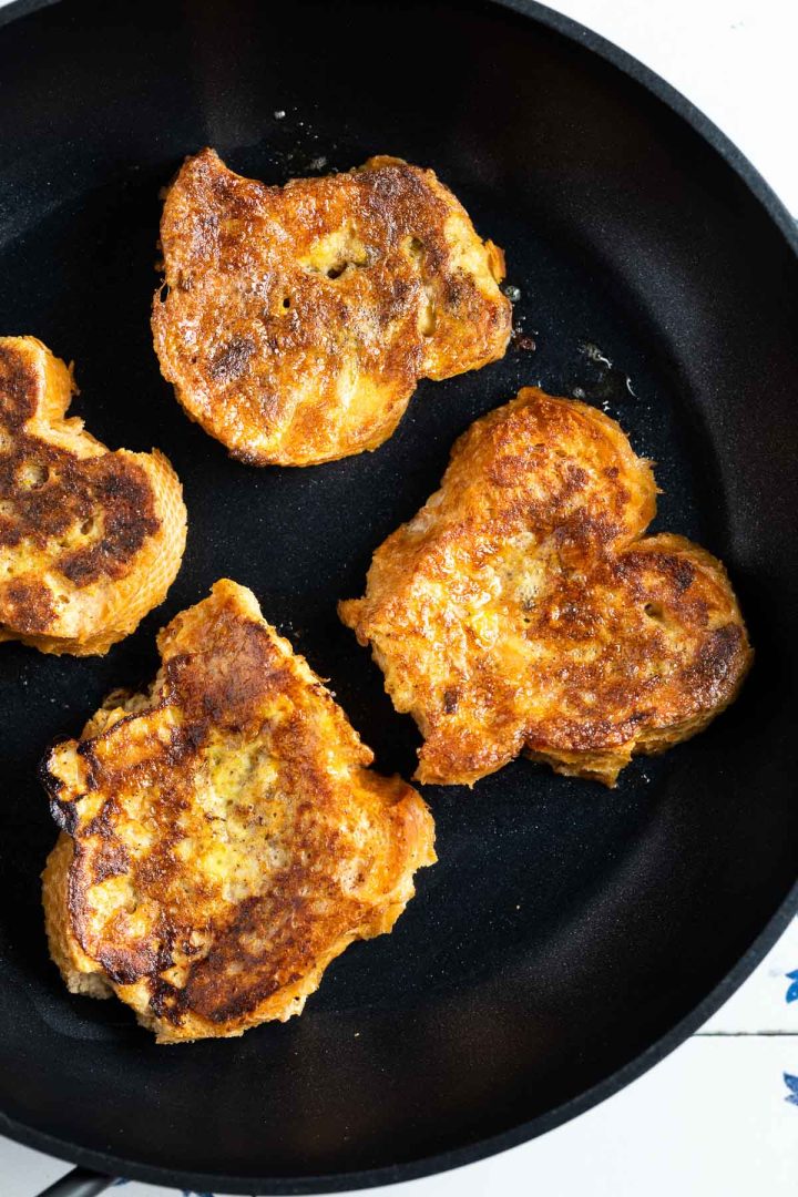 Spanish French toast being fried in a saucepan