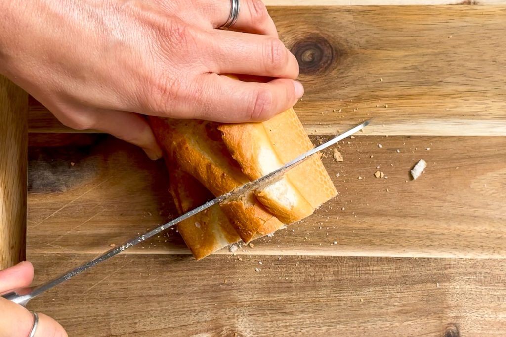 Cutting a stale baguette in to slices