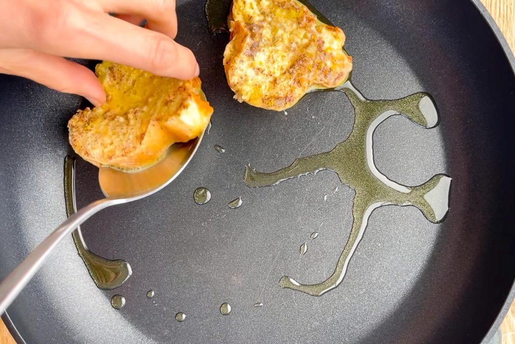 frying slices of baguette in olive oil in a large non stick frying pan.