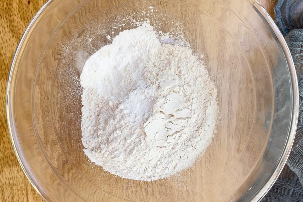 flour and baking powder in a mixing bowl.