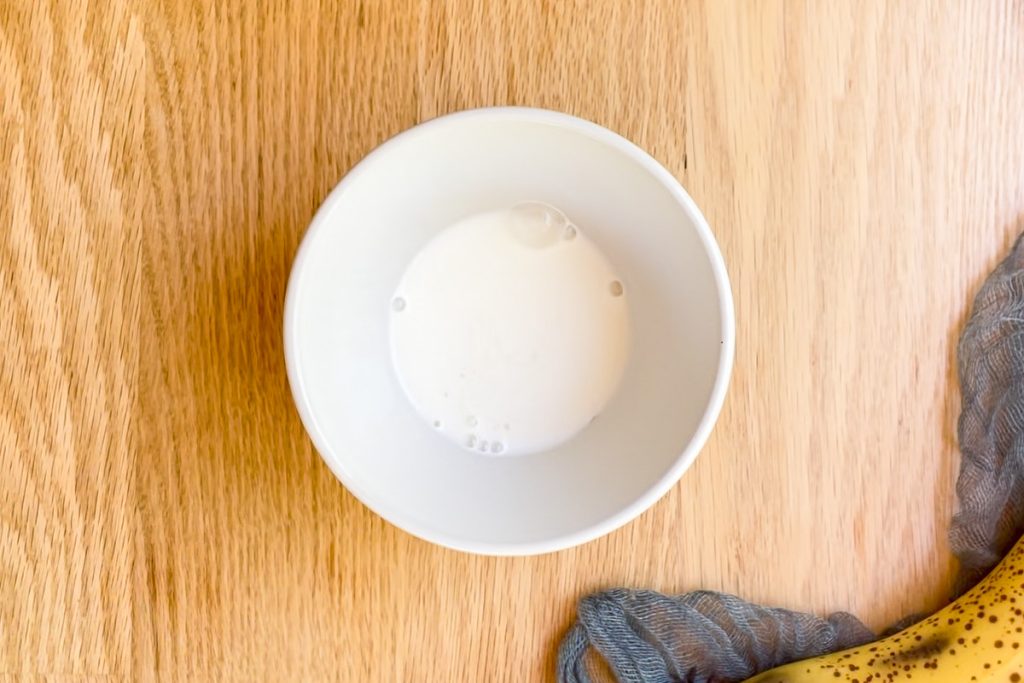 milk and vinegar in a small white bowl.