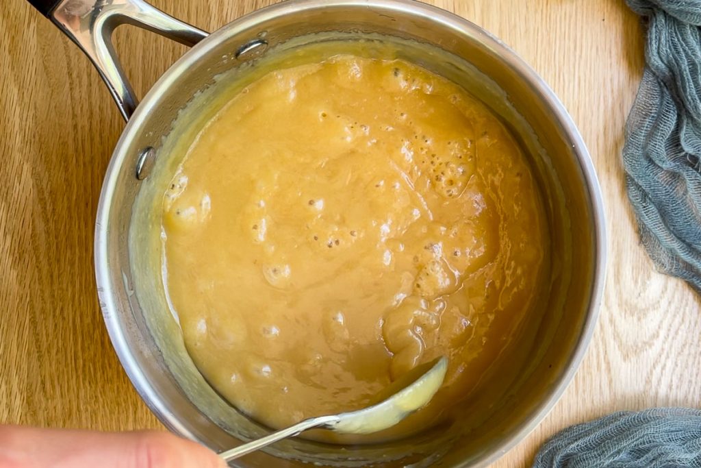 the cooked caramel in the saucepan.