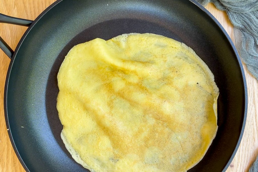 a cooked pancake in the pan.