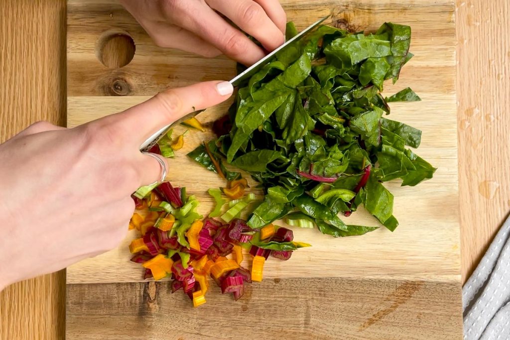 chopping the silverbeet leaves and the stalks into pieces.