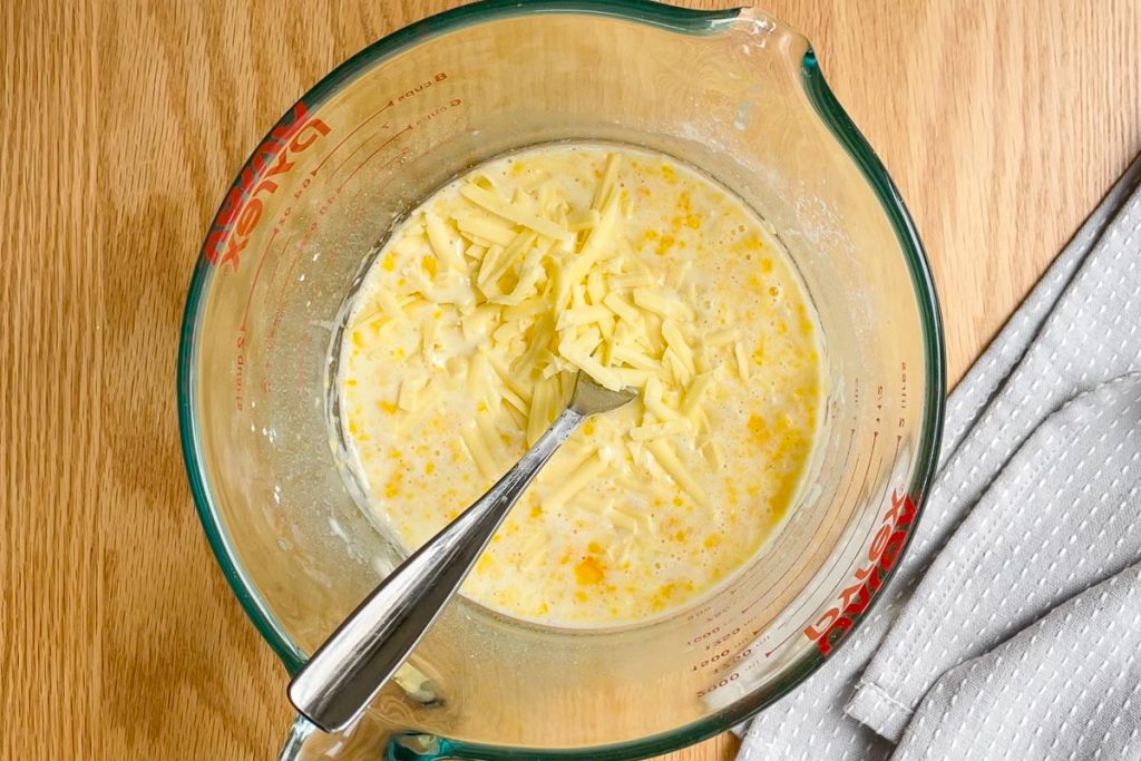 whisked eggs, flour, milk and cheese in a jig.