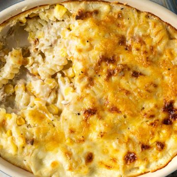 tuna pasta bake in oval baking dish with a portion taken out.