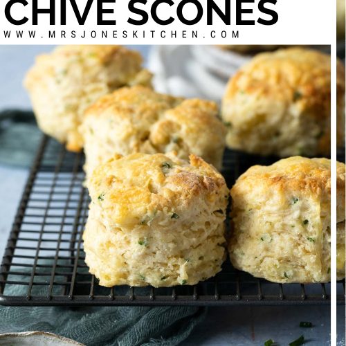 cheese and chive scones on metal cooling rack with text overlay to create pin for Pinterest.