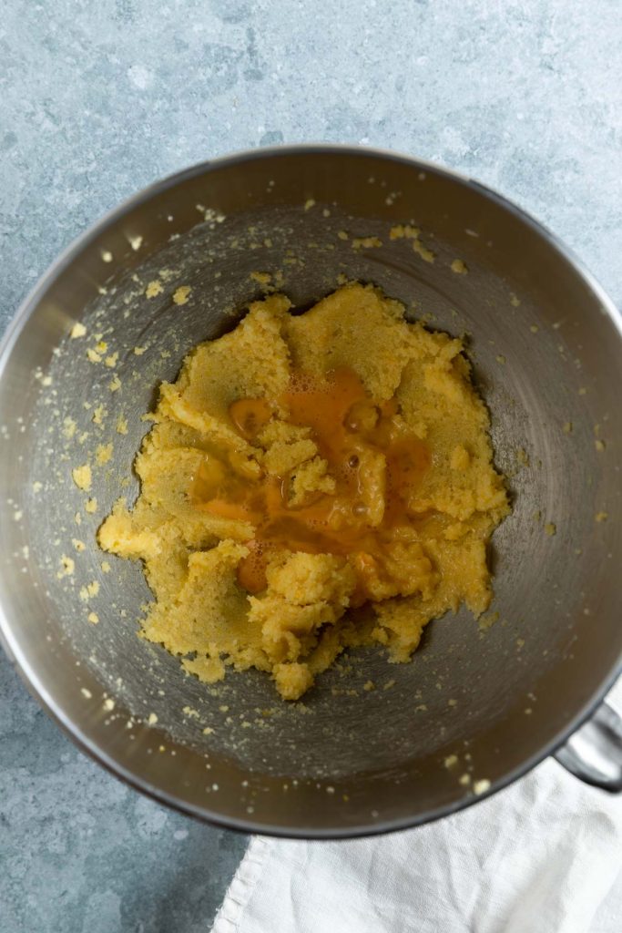 whisked sugar and butter in a stand mixer bowl with beaten eggs added to it.