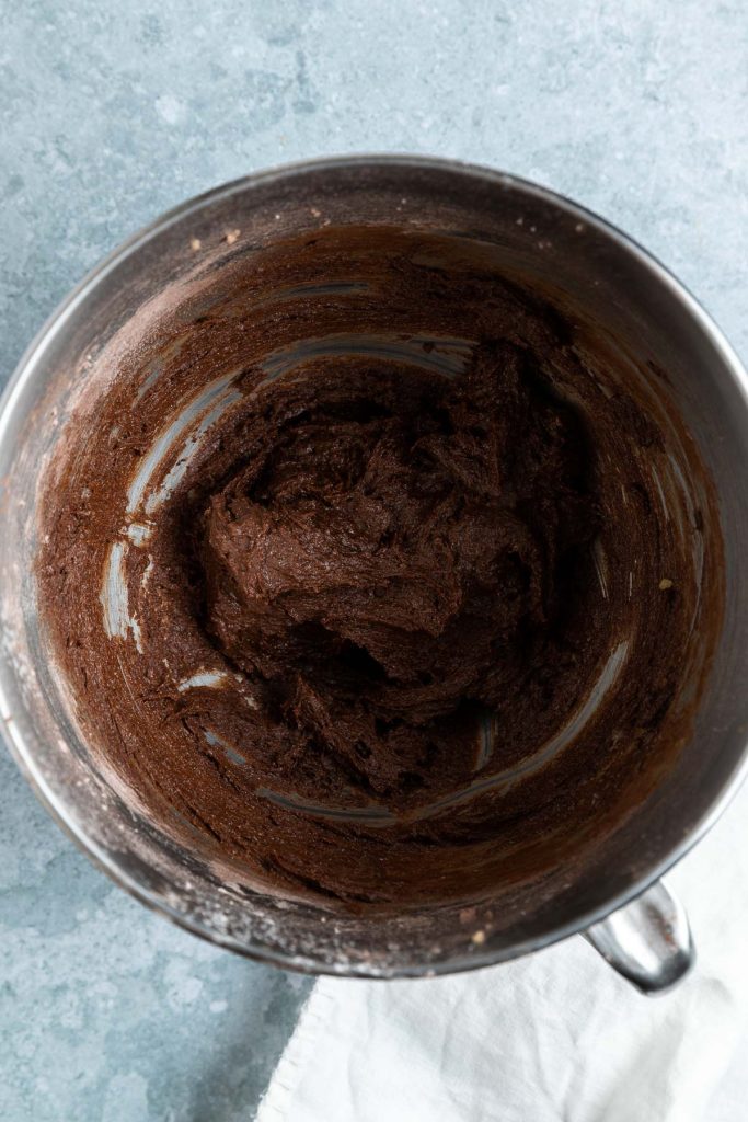 The mixed chocolate orange cupcake batter in the stand mixer bowl.