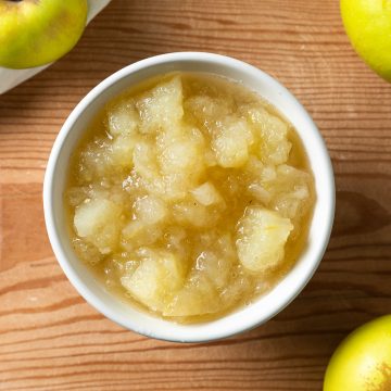 A white bowl filled with stewed apples.