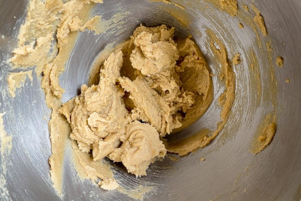 butter and sugars creamed together in the bowl of a stand mixer.